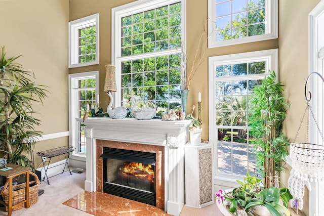 1119 Links Rd, Myrtle Beach, SC 29575 - carpeted living area featuring a fireplace with flush hearth