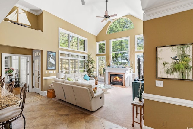 1119 Links Rd, Myrtle Beach, SC 29575 - living area with a ceiling fan, a fireplace with flush hearth, baseboards, crown molding, and high vaulted ceiling
