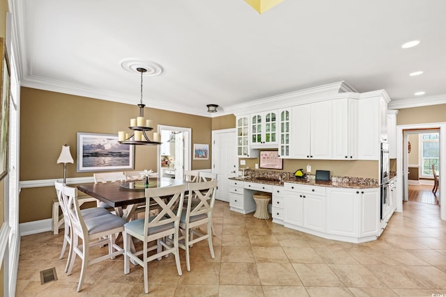 1119 Links Rd, Myrtle Beach, SC 29575 - kitchen with ornamental molding, white cabinetry, dark stone countertops, glass insert cabinets, and light tile patterned floors