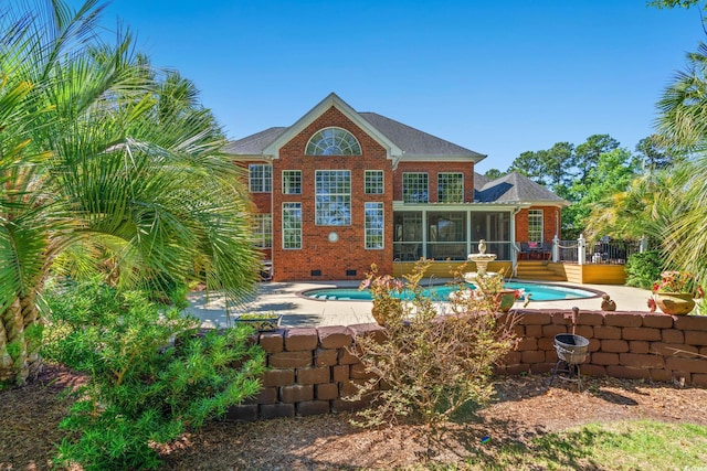 1119 Links Rd, Myrtle Beach, SC 29575 - back of property with a sunroom, an outdoor pool, brick siding, crawl space, and a wooden deck