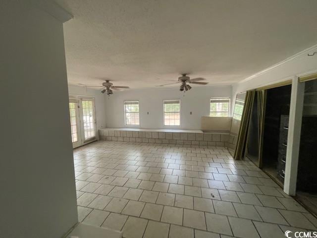 2862 Loblolly Ave, Little River, SC 29566 - empty room with a ceiling fan and light tile patterned floors