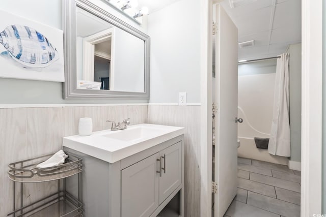 201 74th Ave N Unit 2243/2244, Myrtle Beach, SC 29572 - full bath featuring vanity, wainscoting, shower / bath combo, and tile patterned floors