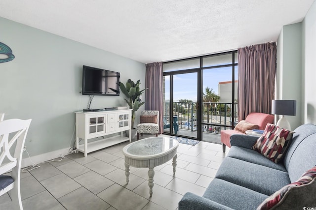 201 74th Ave N Unit 2243/2244, Myrtle Beach, SC 29572 - living room featuring floor to ceiling windows, tile patterned flooring, and a textured ceiling