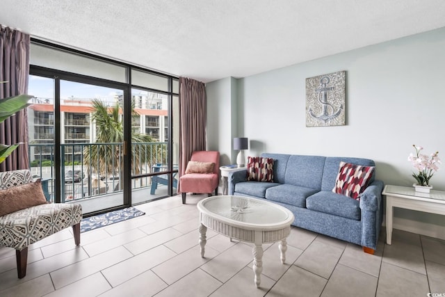 201 74th Ave N Unit 2243/2244, Myrtle Beach, SC 29572 - living room with expansive windows, a textured ceiling, and tile patterned flooring