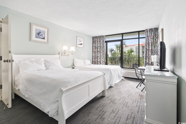 201 74th Ave N Unit 2243/2244, Myrtle Beach, SC 29572 - bedroom with a textured ceiling and floor to ceiling windows