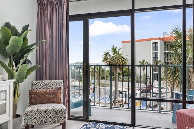 201 74th Ave N Unit 2243/2244, Myrtle Beach, SC 29572 - doorway to outside with healthy amount of natural light and floor to ceiling windows
