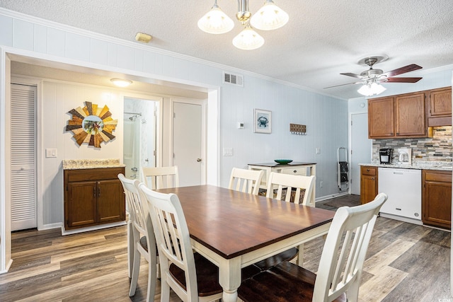 6000 N Ocean Blvd Unit 329, North Myrtle Beach, SC 29582 - dining space featuring crown molding, light wood-type flooring, a textured ceiling, a ceiling fan, and a chandelier