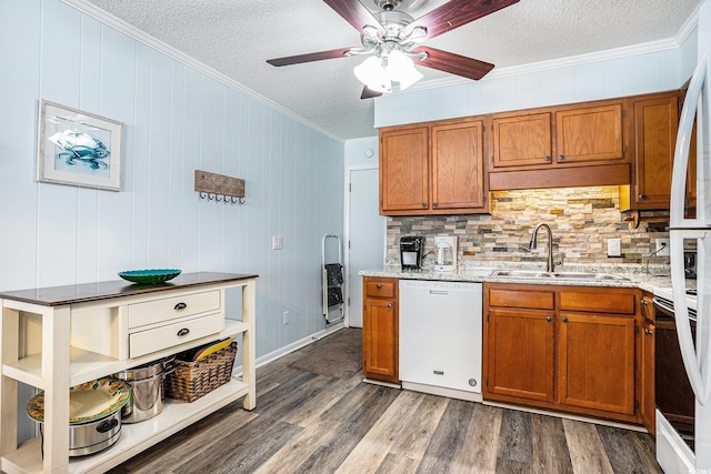 6000 N Ocean Blvd Unit 329, North Myrtle Beach, SC 29582 - kitchen with white dishwasher, a sink, a textured ceiling, brown cabinetry, and ornamental molding