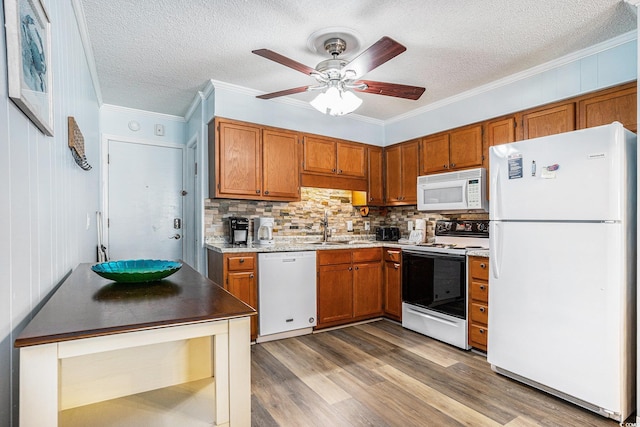 6000 N Ocean Blvd Unit 329, North Myrtle Beach, SC 29582 - kitchen with white appliances, brown cabinets, backsplash, a textured ceiling, and ornamental molding