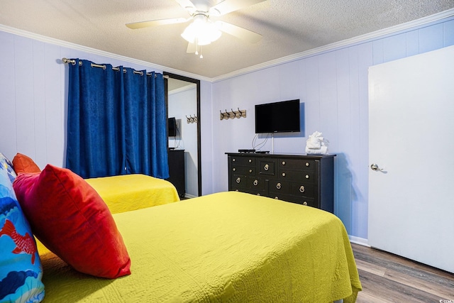 6000 N Ocean Blvd Unit 329, North Myrtle Beach, SC 29582 - bedroom with wood finished floors, ornamental molding, a ceiling fan, and a textured ceiling