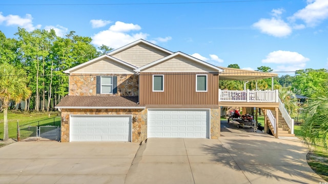 3721 Ed Smith Ave, Myrtle Beach, SC 29588 - view of front of property with stone siding, driveway, an attached garage, and stairway