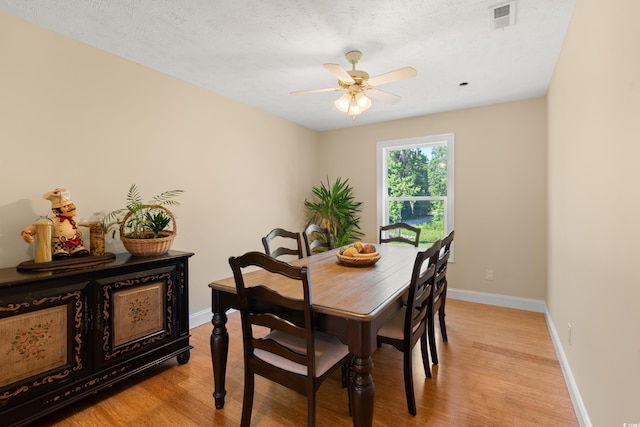 3721 Ed Smith Ave, Myrtle Beach, SC 29588 - dining area with light wood-style flooring, a ceiling fan, and baseboards