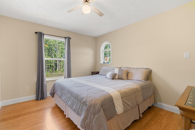 3721 Ed Smith Ave, Myrtle Beach, SC 29588 - bedroom with light wood finished floors, baseboards, and ceiling fan
