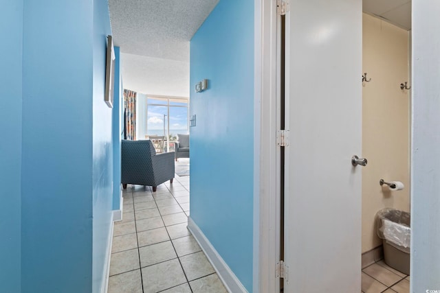 1708 N Ocean Blvd Unit 101, Myrtle Beach, SC 29577 - hallway featuring light tile patterned floors and baseboards