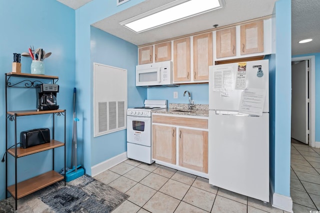 1708 N Ocean Blvd Unit 101, Myrtle Beach, SC 29577 - kitchen with white appliances, light brown cabinetry, light tile patterned floors, and a sink