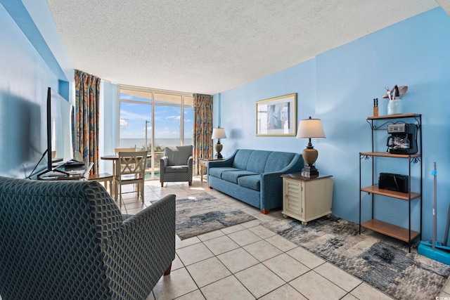 1708 N Ocean Blvd Unit 101, Myrtle Beach, SC 29577 - living area featuring light tile patterned flooring, a textured ceiling, and a wall of windows