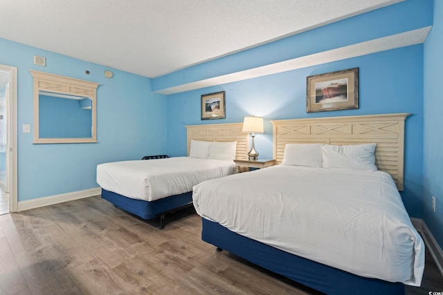 1708 N Ocean Blvd Unit 101, Myrtle Beach, SC 29577 - bedroom featuring wood finished floors and baseboards