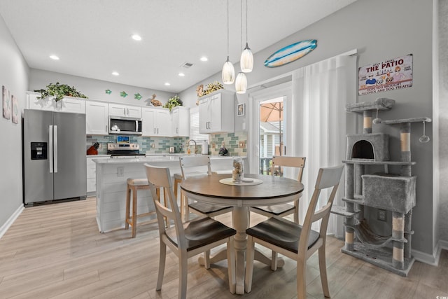 503 20th Ave N Unit 55B, North Myrtle Beach, SC 29582 - dining area with light wood-type flooring and recessed lighting