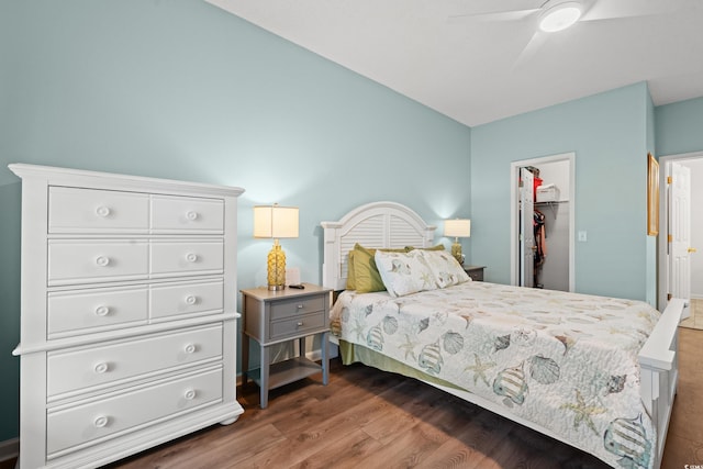503 20th Ave N Unit 55B, North Myrtle Beach, SC 29582 - bedroom featuring a spacious closet, a closet, dark wood-style flooring, and ceiling fan