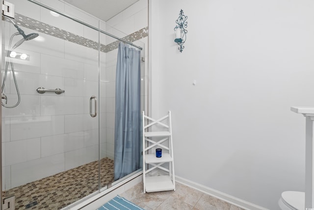 503 20th Ave N Unit 55B, North Myrtle Beach, SC 29582 - bathroom with a shower stall, toilet, and baseboards