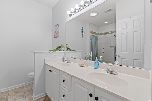 503 20th Ave N Unit 55B, North Myrtle Beach, SC 29582 - full bath featuring double vanity, toilet, a shower stall, and baseboards