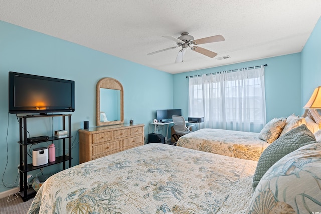 503 20th Ave N Unit 55B, North Myrtle Beach, SC 29582 - bedroom featuring a textured ceiling, ceiling fan, and carpet floors