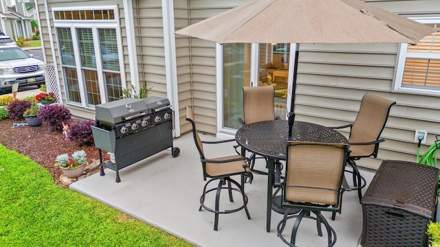503 20th Ave N Unit 55B, North Myrtle Beach, SC 29582 - view of patio / terrace with a grill and outdoor dining space