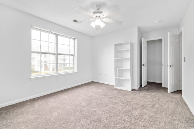 3762 Citation Way Unit 1023, Myrtle Beach, SC 29577 - unfurnished bedroom with carpet, baseboards, a closet, and ceiling fan