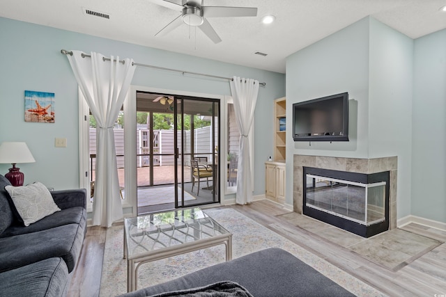 435 Ocean Creek Dr Unit 2722, Myrtle Beach, SC 29572 - living area with wood finished floors, a ceiling fan, a fireplace, baseboards, and recessed lighting