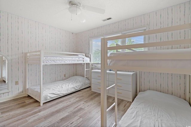 435 Ocean Creek Dr Unit 2722, Myrtle Beach, SC 29572 - bedroom featuring wallpapered walls and wood finished floors