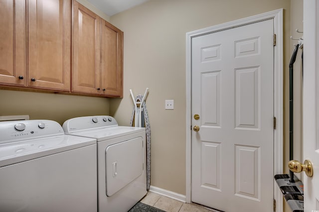24 Willowbend Dr, Murrells Inlet, SC 29576 - laundry room featuring washer and clothes dryer, cabinet space, light tile patterned flooring, and baseboards