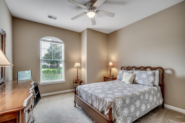 24 Willowbend Dr, Murrells Inlet, SC 29576 - bedroom featuring light carpet, multiple windows, and baseboards