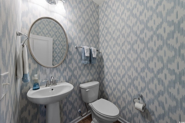 281 Lumbee Cir, Pawleys Island, SC 29585 - bathroom with toilet, wallpapered walls, baseboards, and wood finished floors