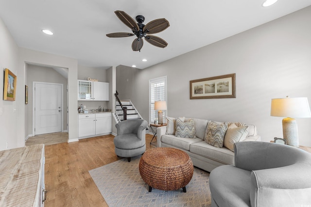 281 Lumbee Cir, Pawleys Island, SC 29585 - living room with light wood-style floors, ceiling fan, recessed lighting, stairway, and baseboards