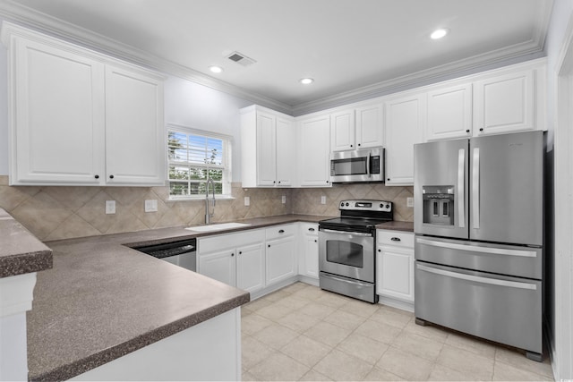 373 Skyland Pines Dr, Myrtle Beach, SC 29588 - kitchen featuring stainless steel appliances, a sink, crown molding, white cabinets, and dark countertops