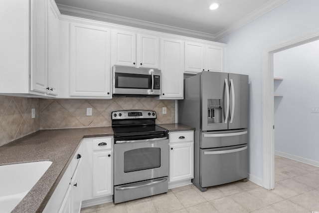 373 Skyland Pines Dr, Myrtle Beach, SC 29588 - kitchen with stainless steel appliances, crown molding, white cabinetry, dark countertops, and tasteful backsplash