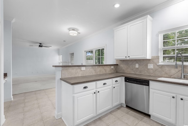 373 Skyland Pines Dr, Myrtle Beach, SC 29588 - kitchen featuring dishwasher, a sink, a peninsula, dark countertops, and healthy amount of natural light