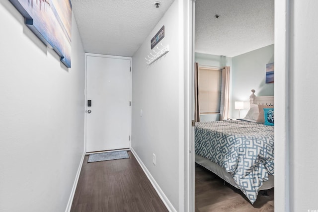 920 N Waccamaw Dr Unit 1302, Garden City Beach, SC 29576 - corridor with wood finished floors, baseboards, and a textured ceiling
