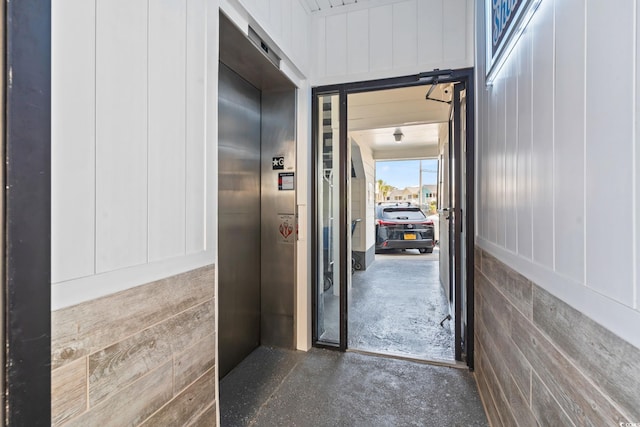 920 N Waccamaw Dr Unit 1302, Garden City Beach, SC 29576 - corridor with elevator and concrete flooring