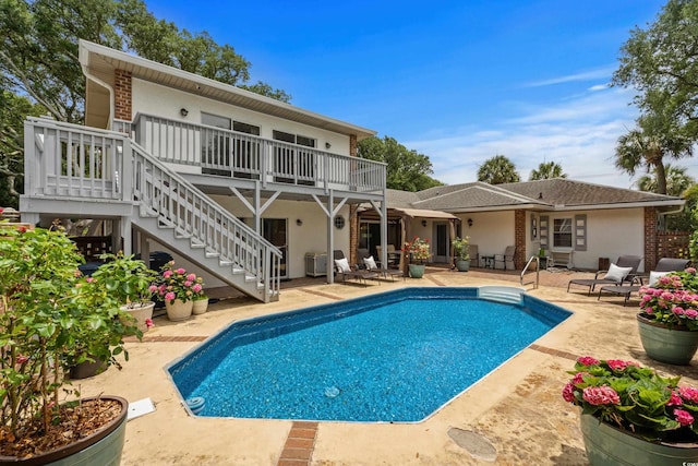 6401 N Ocean Blvd, Myrtle Beach, SC 29572 - rear view of house featuring a patio area, stucco siding, and stairs