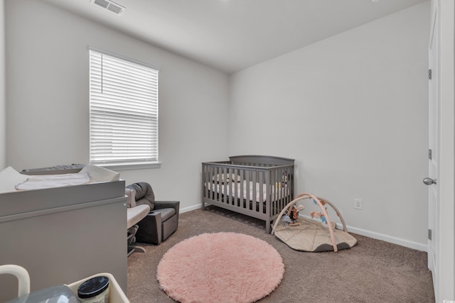 553 Pier Ct, Little River, SC 29566 - carpeted bedroom with baseboards and a crib