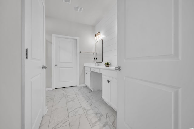 553 Pier Ct, Little River, SC 29566 - bathroom featuring marble look tile flooring, vanity, and baseboards