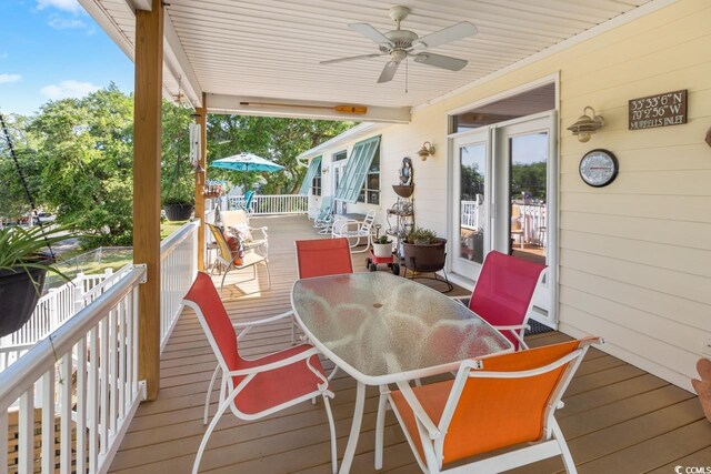 3926 Flagg St, Murrells Inlet, SC 29576 - wooden deck featuring outdoor dining space and ceiling fan