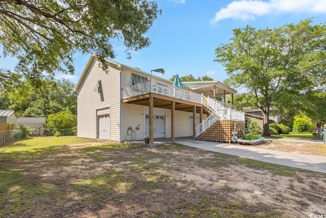 3926 Flagg St, Murrells Inlet, SC 29576 - rear view of property featuring a deck, an attached garage, stairway, and driveway