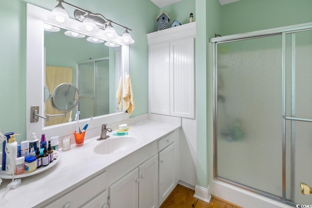 3926 Flagg St, Murrells Inlet, SC 29576 - full bath with vanity, a shower stall, and wood finished floors