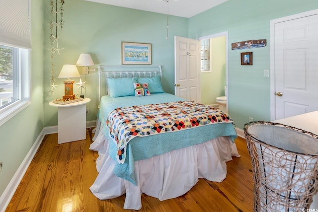 3926 Flagg St, Murrells Inlet, SC 29576 - bedroom featuring wood finished floors, baseboards, and ensuite bathroom
