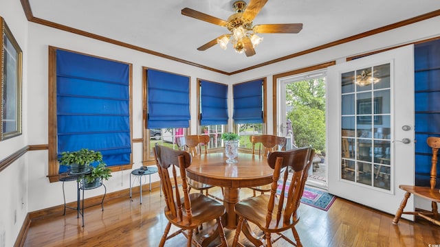 412 Carolina Dr, Loris, SC 29569 - dining space featuring hardwood / wood-style flooring, crown molding, and a ceiling fan