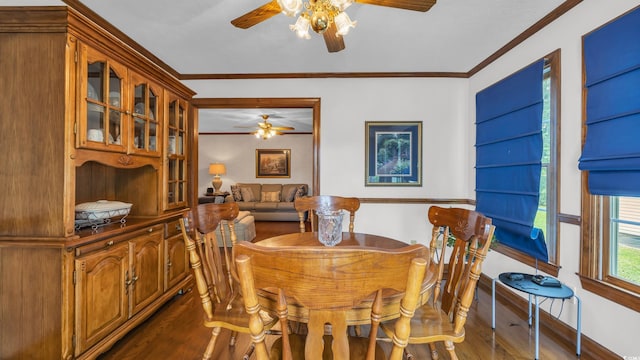412 Carolina Dr, Loris, SC 29569 - dining area featuring ceiling fan, dark wood-style flooring, and crown molding