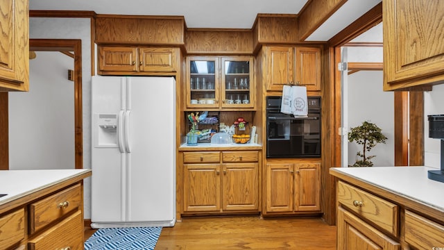 412 Carolina Dr, Loris, SC 29569 - kitchen featuring white fridge with ice dispenser, oven, and light countertops