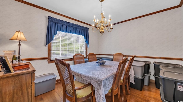 412 Carolina Dr, Loris, SC 29569 - dining area with a chandelier, wood finished floors, and ornamental molding